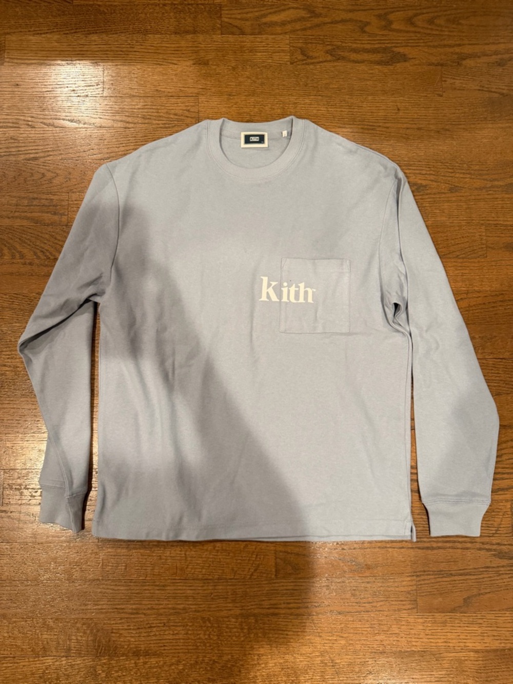 Kith Light Blue Long Sleeve Pocket Tee with Cream Logo
